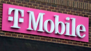 T-Mobile sign includes the company's wordmark in white against a magenta backdrop.