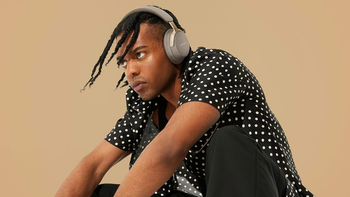 A person wearing a pair of Bose QuietComfort Ultra.