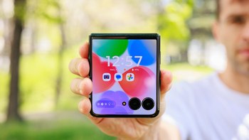 A person holds the Motorola Razr Ultra (2025) folded, showcasing its bright and large external display.